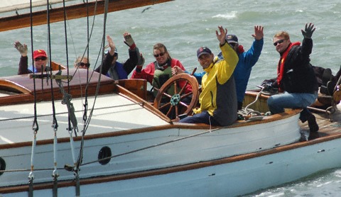 Crew waving from Yankee's cockpit